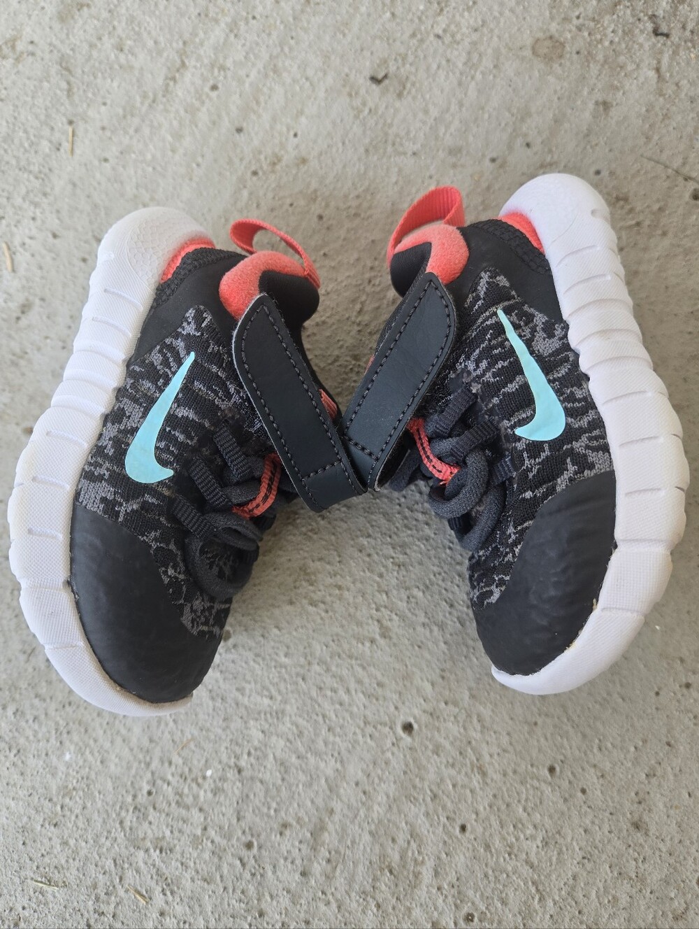 Nike Baby Black Sneakers with Teal Swoosh and Coral Lining